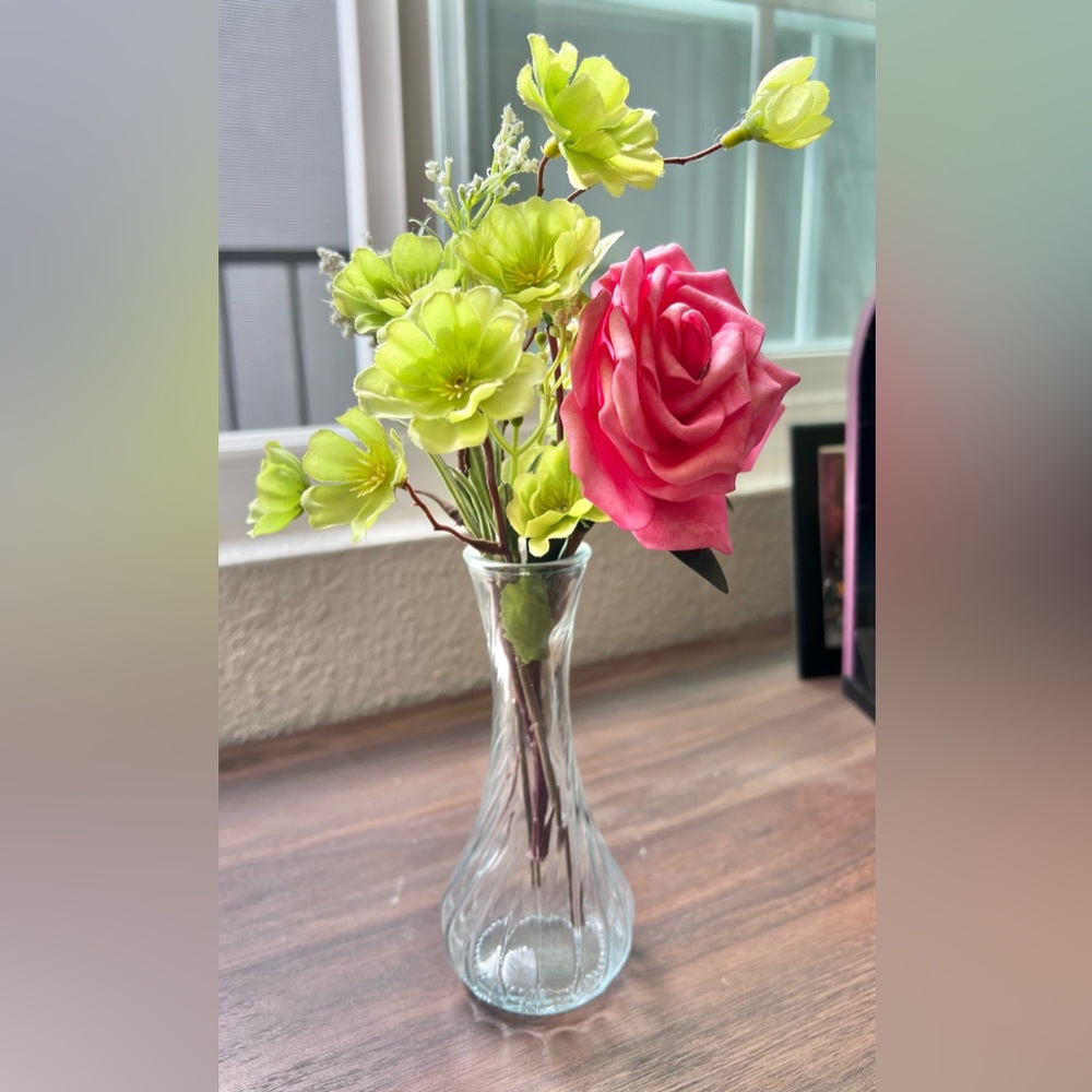 Faux flowers green and pink in a vase